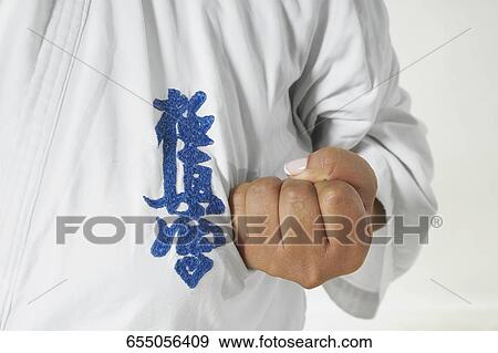 Mid section view of a man practicing karate View Large Photo Image Stock Photo - Mid section view of a man practicing karate. Fotosearch