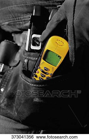 Mid section view of a manual worker wearing a tool belt View Large Photo Image Stock Photograph - Mid section view of a manual worker wearing a tool belt. Fotosearch