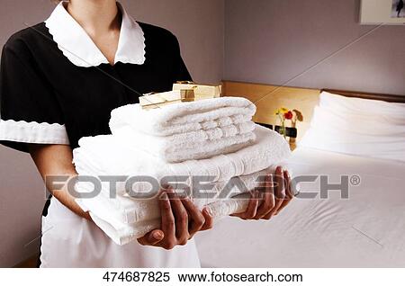 Mid section view of a waitress holding towels and bars of soap View Large Photo Image Stock Photography - Mid section view of a waitress holding towels and bars of soap. Fotosearch
