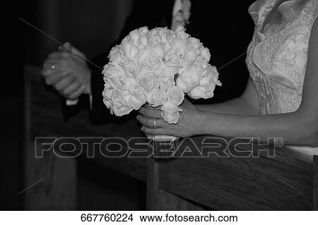 Newlywed couple standing in a church View Large Photo Image Picture - Newlywed couple standing in a church. Fotosearch