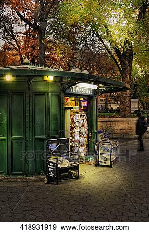 Newsstand lit up at night View Large Photo Image Stock Photo - Newsstand lit up at night. Fotosearch