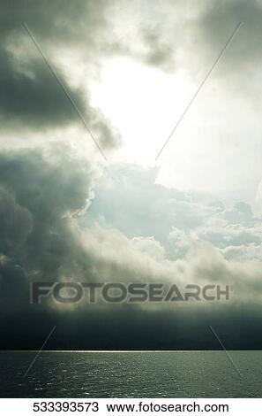 Stock Image - Overcast sky over the sea, Singapore. Fotosearch