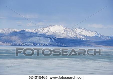 Panoramic view of a lake with a mountain range in the background, Yellowstone Lake, Yellowstone National Park, Wyoming, USA View Large Photo Image Stock Photography - Panoramic view of a lake with a mountain range in the background, Yellowstone Lake, Yellowstone National Park, Wyoming, USA. Fotosearch