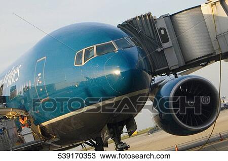 Passenger boarding in an airplane, Paris, Ile-de-France, France View Large Photo Image Stock Image - Passenger boarding in an airplane, Paris, Ile-de-France, France. Fotosearch