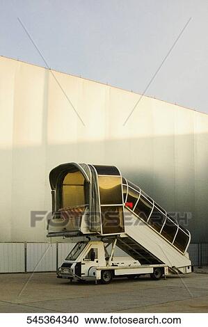 Passenger boarding stairs at an airport, Paris, France View Large Photo Image Stock Image - Passenger boarding stairs at an airport, Paris, France. Fotosearch