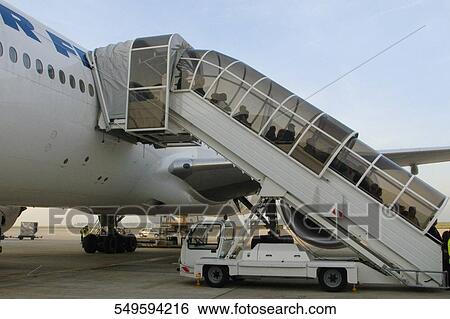 Passenger boarding stairs at an airport, Paris, France View Large Photo Image Stock Photograph - Passenger boarding stairs at an airport, Paris, France. Fotosearch