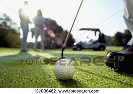 Person playing golf in a golf course View Large Photo Image Stock Image - Person playing golf in a golf course. Fotosearch
