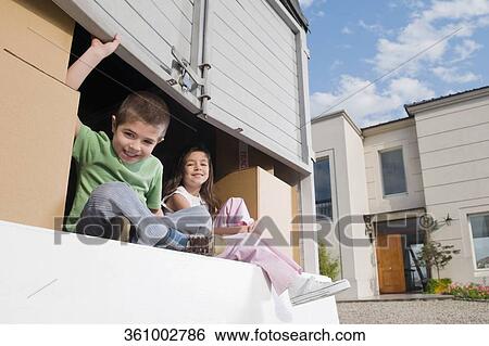 Portrait of a boy sitting with his sister in a pick-up truck and smiling View Large Photo Image Stock Photograph - Portrait of a boy sitting with his sister in a pick-up truck and smiling. Fotosearch