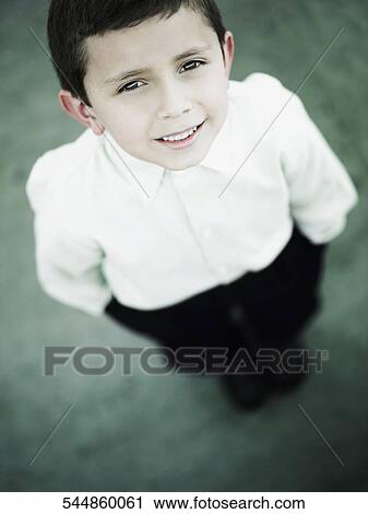 Portrait of a boy standing with his hands in his pockets View Large Photo Image Stock Image - Portrait of a boy standing with his hands in his pockets. Fotosearch