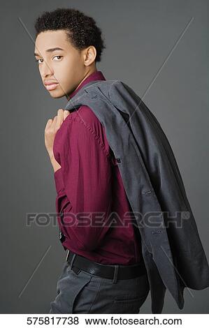 Portrait of a businessman carrying his coat over his shoulder View Large Photo Image Stock Photo - Portrait of a businessman carrying his coat over his shoulder. Fotosearch