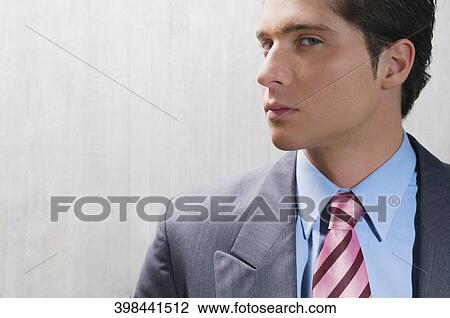 Stock Image - Portrait of a businessman looking serious. Fotosearch