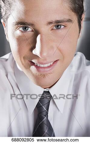 Portrait of a businessman smiling View Large Photo Image Stock Photography - Portrait of a businessman smiling. Fotosearch