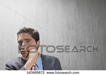 Portrait of a businessman thinking View Large Photo Image Stock Image - Portrait of a businessman thinking. Fotosearch