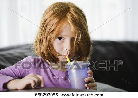 Portrait of a girl drinking chocolate milkshake View Large Photo Image Stock Photography - Portrait of a girl drinking chocolate milkshake. Fotosearch