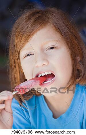 Portrait of a girl eating an ice cream View Large Photo Image Stock Photograph - Portrait of a girl eating an ice cream. Fotosearch