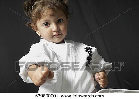 Portrait of a girl practicing karate View Large Photo Image Stock Image - Portrait of a girl practicing karate. Fotosearch