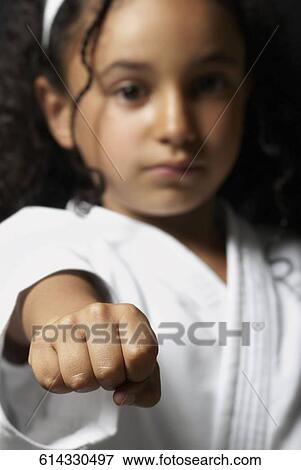 Portrait of a girl practicing karate View Large Photo Image Stock Photo - Portrait of a girl practicing karate. Fotosearch