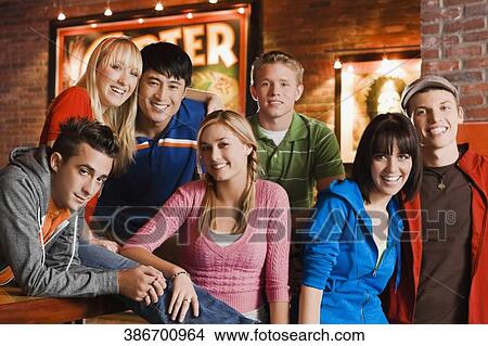 Portrait of a group of friends smiling View Large Photo Image Picture - Portrait of a group of friends smiling. Fotosearch