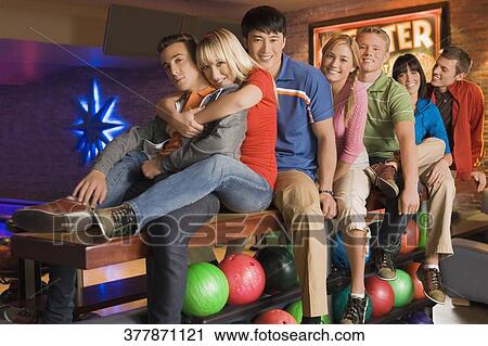 Stock Image - Portrait of a group of friends smiling. Fotosearch
