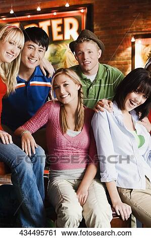 Stock Image - Portrait of a group of friends smiling. Fotosearch