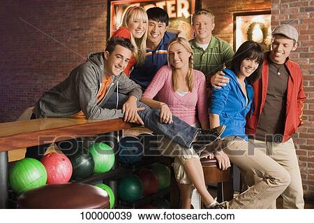Portrait of a group of friends smiling View Large Photo Image Stock Photo - Portrait of a group of friends smiling. Fotosearch