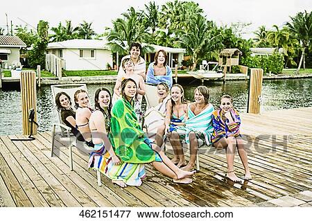 Stock Photo - Portrait of a group of friends smiling. Fotosearch