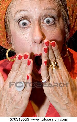 Portrait of a mature woman looking shocked View Large Photo Image Stock Image - Portrait of a mature woman looking shocked. Fotosearch