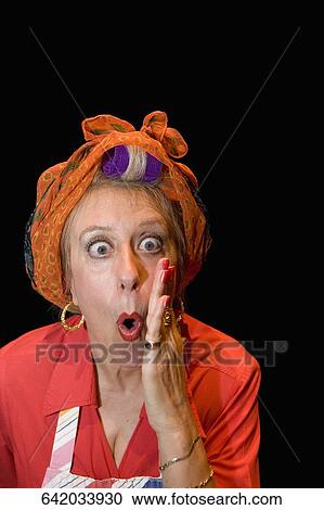Portrait of a mature woman looking shocked View Large Photo Image Stock Image - Portrait of a mature woman looking shocked. Fotosearch