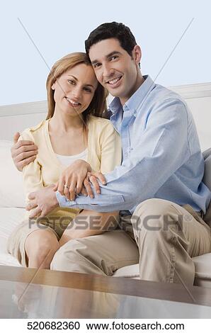 Stock Image - Portrait of a mid adult couple smiling. Fotosearch