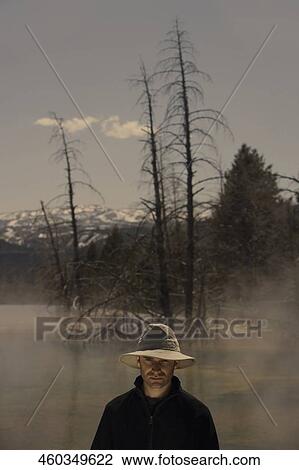 Stock Image - Portrait of a mid adult man thinking. Fotosearch