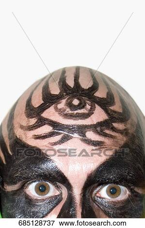 Portrait of a mid adult man with face paint on his face View Large Photo Image Stock Photo - Portrait of a mid adult man with face paint on his face. Fotosearch