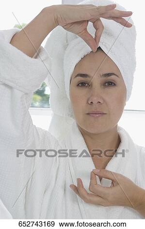 Portrait of a mid adult woman gesturing View Large Photo Image Stock Photo - Portrait of a mid adult woman gesturing. Fotosearch