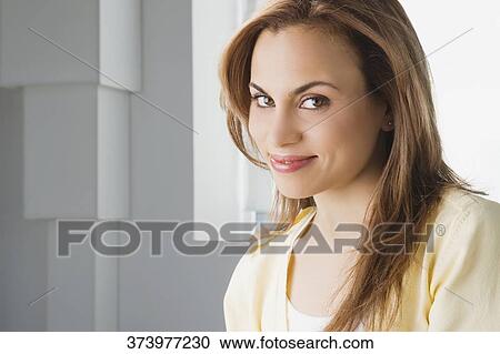 Portrait of a mid adult woman smiling View Large Photo Image Stock Image - Portrait of a mid adult woman smiling. Fotosearch
