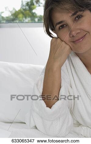 Portrait of a mid adult woman smiling View Large Photo Image Stock Photo - Portrait of a mid adult woman smiling. Fotosearch