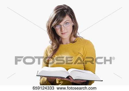 Portrait of a teenage girl reading a book View Large Photo Image Stock Image - Portrait of a teenage girl reading a book. Fotosearch