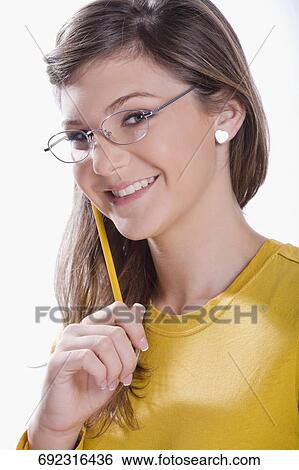 Portrait of a teenage girl smiling View Large Photo Image Stock Photograph - Portrait of a teenage girl smiling. Fotosearch