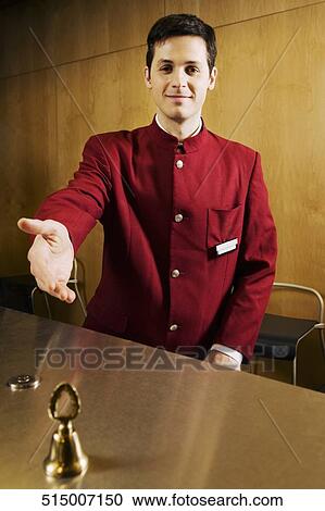 Portrait of a waiter at the hotel reception View Large Photo Image Stock Image - Portrait of a waiter at the hotel reception. Fotosearch