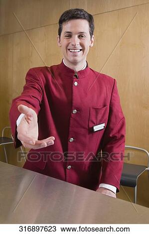 Portrait of a waiter smiling View Large Photo Image Stock Image - Portrait of a waiter smiling. Fotosearch