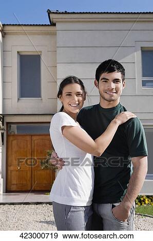 Portrait of a young couple smiling View Large Photo Image Stock Photo - Portrait of a young couple smiling. Fotosearch