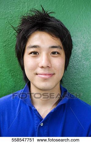 Stock Image - Portrait of a young man smiling. Fotosearch