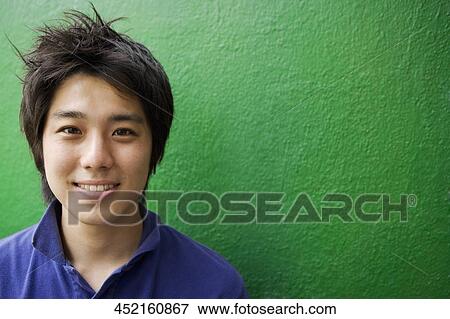 Portrait of a young man smiling View Large Photo Image Stock Photo - Portrait of a young man smiling. Fotosearch