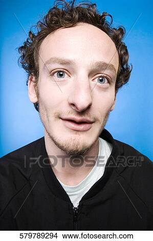Picture - Portrait of a young man thinking. Fotosearch