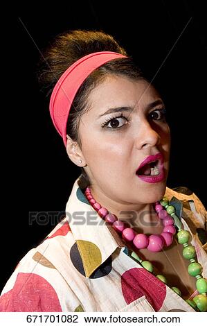 Portrait of a young woman looking shocked View Large Photo Image Stock Image - Portrait of a young woman looking shocked. Fotosearch