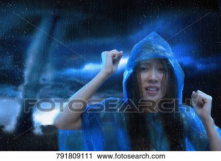 Stock Image - Portrait of a young woman looking worried. Fotosearch