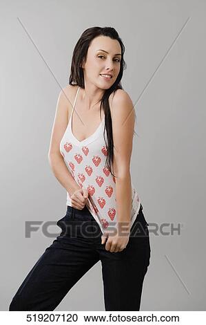 Portrait of a young woman posing View Large Photo Image Stock Image - Portrait of a young woman posing. Fotosearch