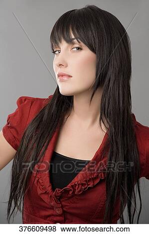Portrait of a young woman posing View Large Photo Image Stock Photo - Portrait of a young woman posing. Fotosearch