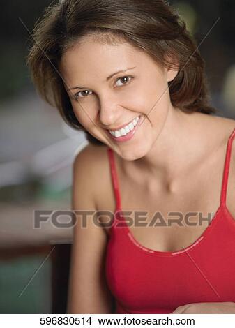 Picture - Portrait of a young woman smiling. Fotosearch
