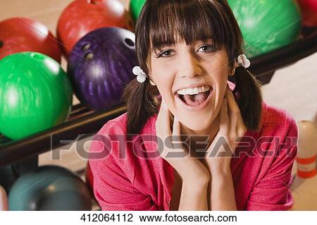Portrait of a young woman smiling View Large Photo Image Stock Image - Portrait of a young woman smiling. Fotosearch