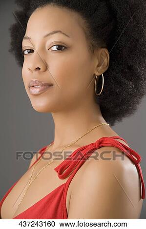 Portrait of a young woman smiling View Large Photo Image Stock Image - Portrait of a young woman smiling. Fotosearch