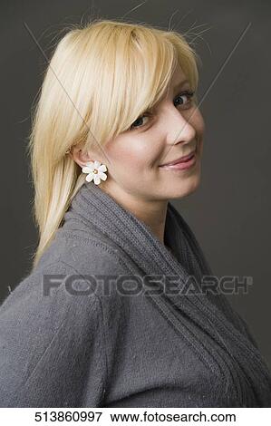 Portrait of a young woman smiling View Large Photo Image Stock Photo - Portrait of a young woman smiling. Fotosearch